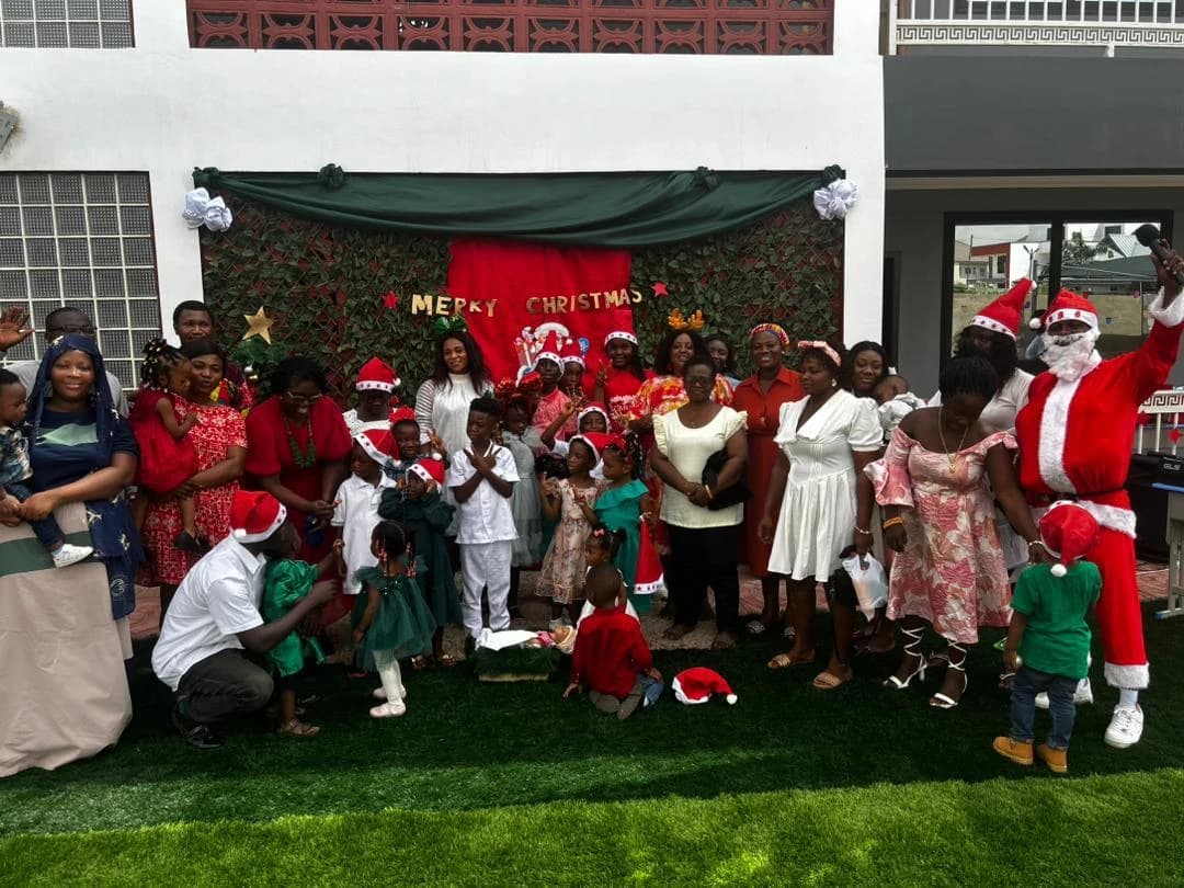 Learners, families, staff, and guests gathered for a group photograph at the Carol Service